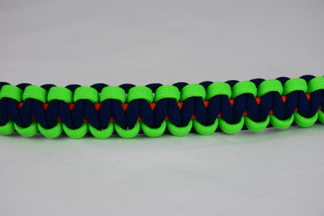 orange neon green and navy blue paracord bracelet unity band across the center of a white background