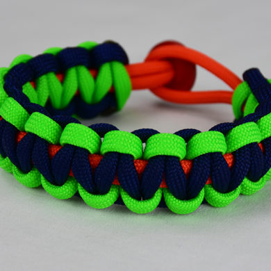 orange neon green and navy blue paracord bracelet with red button back, picture of an orange neon green and navy blue paracord bracelet with red button fastener in the back on a white background