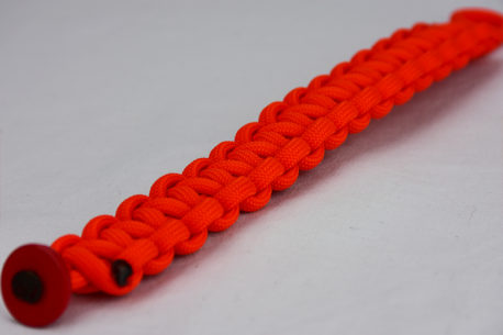 orange paracord bracelet unity band with red button in the bottom corner, orange paracord bracelet unity band with red button