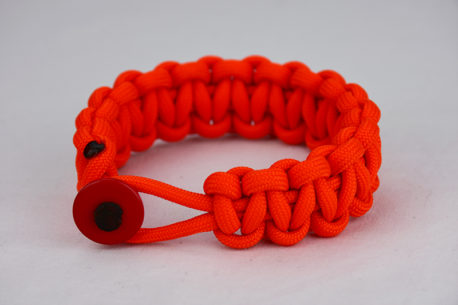 orange paracord bracelet unity band with red button in the front, picture of an orange paracord bracelet unity band with red button