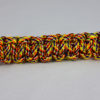 overkill camouflage paracord bracelet unity band across the center of a white background