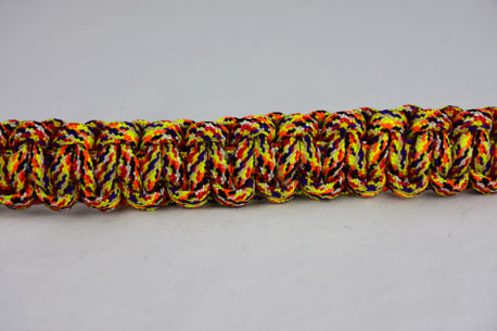 overkill camouflage paracord bracelet unity band across the center of a white background