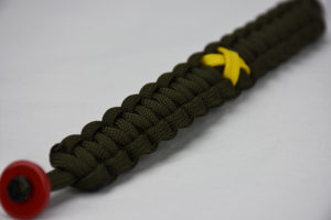 od green military support paracord bracelet unity band, picture of a od green military support paracord bracelet with a red button in the front corner and yellow support ribbon in the center of the band