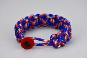 patriotic camouflage paracord bracelet with red button front, picture of a patriotic camouflage paracord bracelet unity band with red button fastener in the front, red white and blue camouflage for patriotism