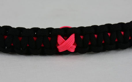 pink and black breast cancer support paracord bracelet with pink ribbon in the center