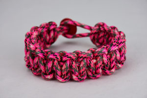 pink camouflage paracord bracelet unity band w red button in back, picture of a pink paracord bracelet unity band with red button fastener in the back