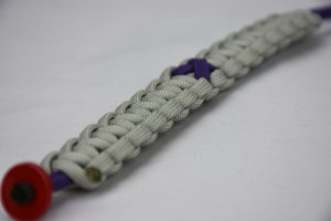 purple and grey alzheimers support paracord bracelet unity band with purple ribbon, purple and grey alzheimers support paracord bracelet unity band with red button fastener in the front corner