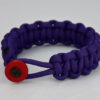 purple paracord bracelet with red button in the front, picture of a purple paracord bracelet unity band with red button fastener in the front