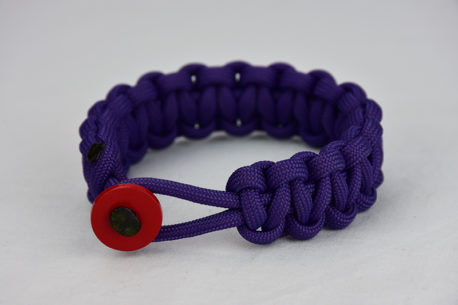 purple paracord bracelet with red button in the front, picture of a purple paracord bracelet unity band with red button fastener in the front