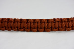 rust paracord bracelet unity band across the center of a white background, rust paracord bracelet unity band