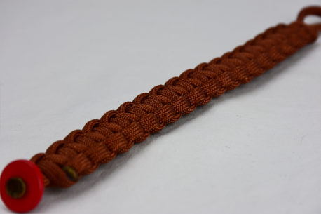 rust paracord bracelet unity band with red button, picture of a rust paracord bracelet unity band with red button fastener in the corner