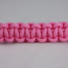 soft pink paracord bracelet unity band across the center of a white background