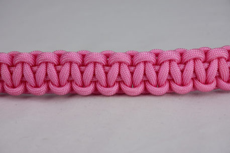 soft pink paracord bracelet unity band across the center of a white background
