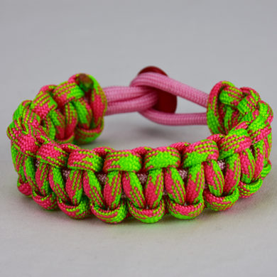 soft pink pink and neon green camouflage paracord bracelet unity band with red button back, picture of a soft pink pink and neon green camouflage paracord bracelet with a red button fastener on a white background