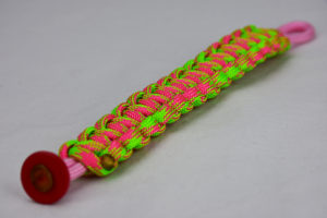 soft pink pink and neon green camouflage paracord bracelet unity band with red button in the corner, picture of a soft pink pink and neon green camouflage paracord bracelet unity band with red button fastener in the corner on a white background