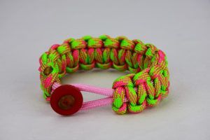 soft pink pink and neon green camouflage paracord bracelet unity band with red button in the front, picture of a soft pink pink and neon green paracord bracelet with red button fastener in the front on a white background