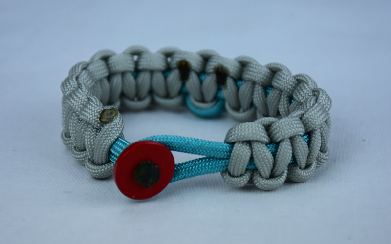 teal and grey ptsd support paracord bracelet with red button front and teal ribbon
