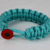 teal paracord bracelet unity band with red button back, picture of a teal paracord bracelet with red button fastener on a white background