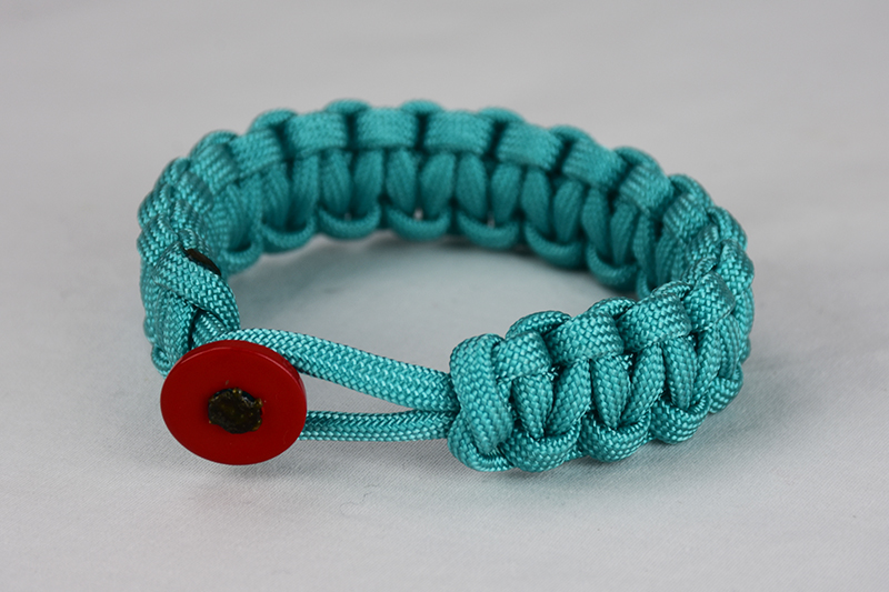 teal paracord bracelet unity band with red button back, picture of a teal paracord bracelet with red button fastener on a white background