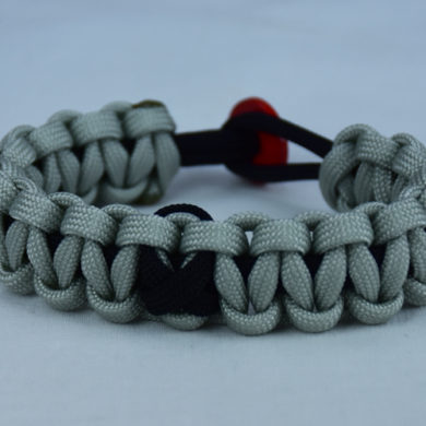 black and grey pow mia support paracord bracelet with red button back and black ribbon