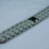 black and grey pow mia support paracord bracelet with red button in the corner and black ribbon