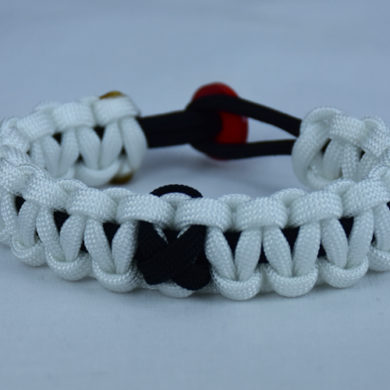 black and white pow mia support paracord bracelet with red button back and black ribbon
