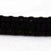 black paracord bracelet across a white background