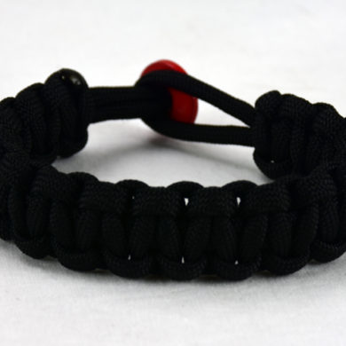 black paracord bracelet with red button back