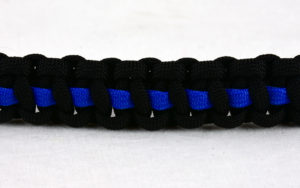 black paracord bracelet with blue line in the center