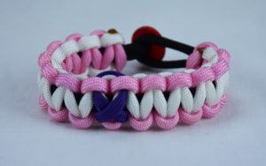 black soft pink and white alzheimers support paracord bracelet with red button in the back and purple ribbon