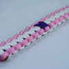black soft pink and white alzheimers support paracord bracelet with red button fastener in the corner and purple ribbon