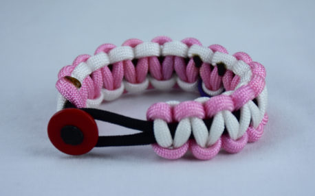 black soft pink and white alzheimers support paracord bracelet with red button in the front and a purple ribbon