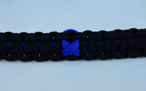 blue and black anti-bullying paracord bracelet with blue ribbon in the center