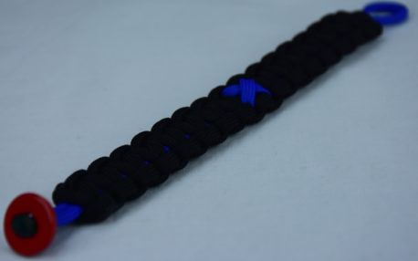 blue and black anti-bullying paracord bracelet with red button in the corner and blue ribbon