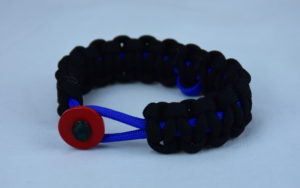 blue and black anti bullying paracord bracelet with red button front and blue ribbon