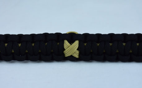 gold and black pediatric cancer support paracord bracelet with gold ribbon in the center