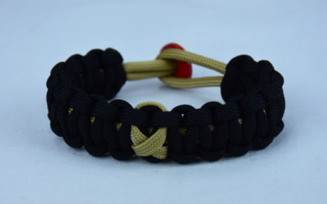 gold and black pediatric cancer support paracord bracelet with red button back and gold ribbon