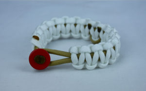 gold and white pediatric cancer support paracord bracelet with red button front and gold ribbon