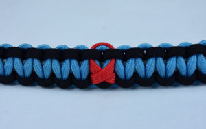 grey black and tarheel blue heart disease support paracord bracelet with red ribbon center