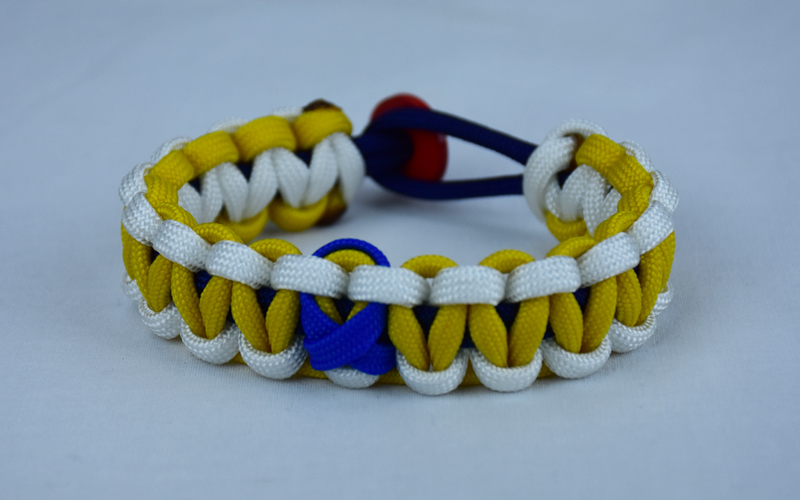 navy blue white and yellow anti bullying paracord bracelet with red button fastener in the back and blue ribbon