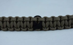 od green and tan pow mia support paracord bracelet with black ribbon in the center