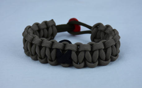 od green and tan pow mia support paracord bracelet with red button back and black ribbon