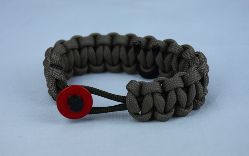 od green and tan pow mia support paracord bracelet with red button front and black ribbon