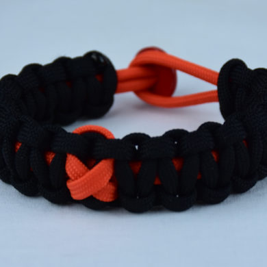 orange and black leukemia support paracord bracelet with red button in the back and orange ribbon