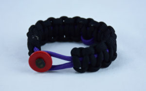 purple and black alzheimers support paracord bracelet with red button in the front and purple ribbon