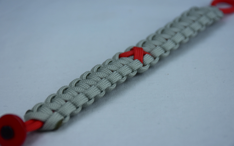 red and grey heart disease support paracord bracelet with red button corner and red ribbon
