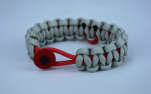 red and grey heart disease support paracord bracelet with red button front and red ribbon