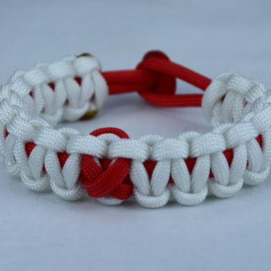 red and white heart disease support paracord bracelet with red button back and red ribbon
