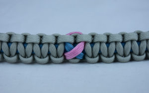 tarheel blue and grey sids support paracord bracelet with tarheel blue and pink ribbon in the center
