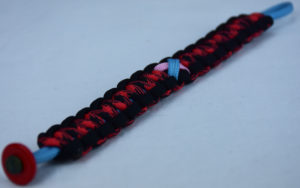tarheel blue black and red and black camouflage sids support paracord bracelet with red button in the corner and tarheel blue and soft pink ribbon